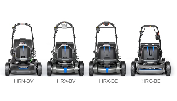 A lineup of Honda battery-powered lawn mowers against a green lawn.