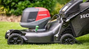 Close up of the battery lawn mower. 